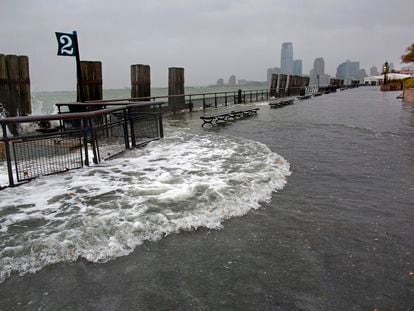 Waves wash over the seawall near high tide at Battery Park in New York, October 29, 2012, as Hurricane Sandy approaches the East Coast.