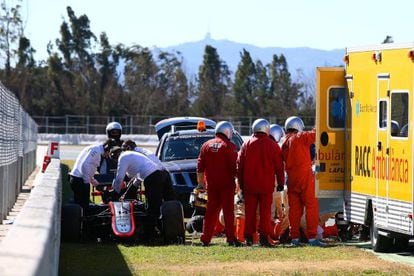 Fernando Alonso receives medical assistance after Sunday’s crash.