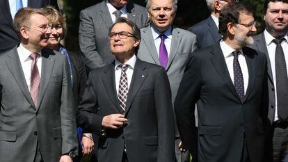 Catalan premier Artur Mas (second from left) and Prime Minister Mariano Rajoy (right) with EU foreign ministers in Barcelona.