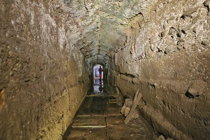A worker in a tunnel in the southern area of the Colosseum during excavations.