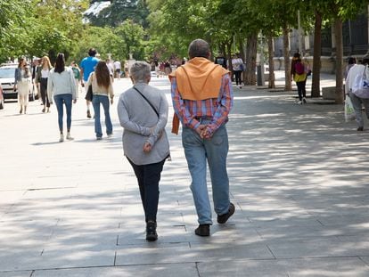 A couple walks along Paseo del Prado, on June 4, 2023, in Madrid, Spain. The population over 64 years of age in Spain now exceeds 20% of the total.