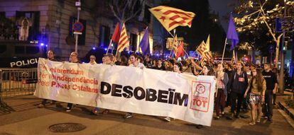 Protestors bear a sign calling for disobedience in Barcelona on Monday.