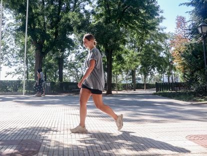 Some people walk through the Parque del Oeste, on September 30 in Madrid.