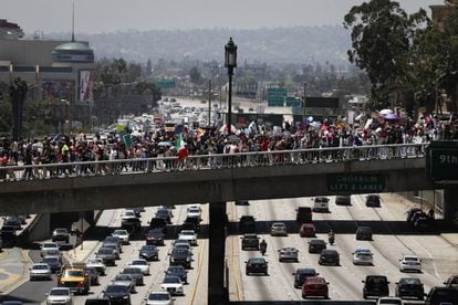 The march in Los Angeles passes over Interstate 110.