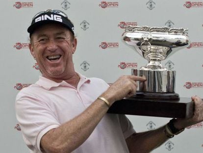 Miguel Angel Jimenez of Spain points out his own name on the trophy after winning the Hong Kong Open for a record-equaling fourth time. 