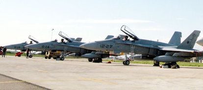 Members of Spain's air force next to an F18 at an Italian base.