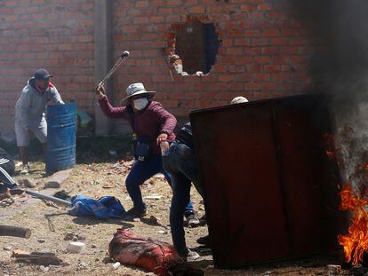 Demonstrators clash with security forces during a protest demanding early elections and the release of jailed former president Pedro Castillo in Juliaca, Peru.