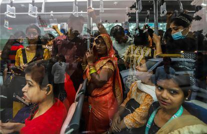 Passengers on a New Delhi bus on November 14.