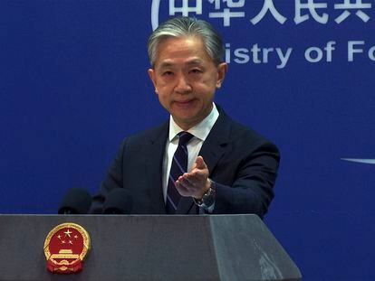 In this image made from video, Chinese Foreign Ministry spokesperson Wang Wenbin gestures as he speaks during a media briefing at the Ministry of Foreign Affairs office in Beijing, Monday, Feb. 13, 2023.