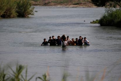 Migrants, mostly from Nicaragua, crossing the Rio Grande off Eagle Pass, Texas.