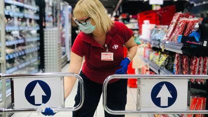 A worker disinfects a supermarket in March 2020.