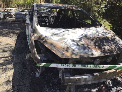 One of the burnt-out vehicles.
