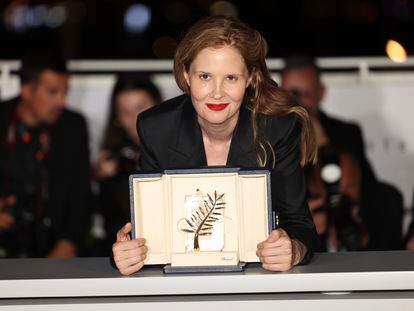 Justine Triet, winner of the Palme d'Or for 'Anatomy of a Fall,' poses for photographers following the awards ceremony at the 76th international film festival Cannes, on May 27, 2023.