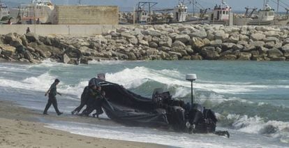 Civil guards push a speedboat used by drug gangs in the Strait of Gibraltar.