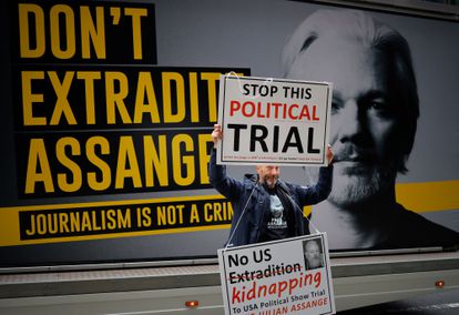 A pro-Assange demonstrator protests outside the Old Bailey court in central London on September 8.