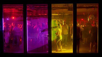 Dozens of people dance at the Bora Bora nightclub in Ibiza.