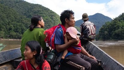 Displaced by the war in Myanmar, refugees cross the Salween River to reach the Thai border.