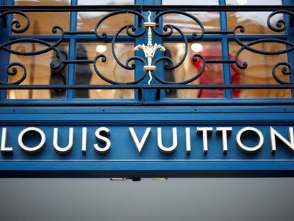 A sign outside a Louis Vuitton luxury boutique operated by LVMH Moet Hennessy Louis SE is pictured in Paris, France, January 25, 2024.