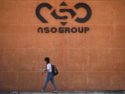 A woman walks by the building entrance of Israeli cyber company NSO Group at one of its branches in the Arava Desert on November 11, 2021 in Sapir, Israel.