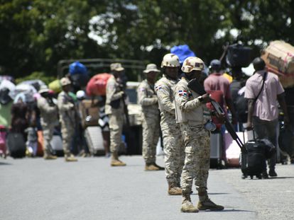 Dominican soldiers guard the border between the Dominican Republic and Haiti on Sept. 14, 2023.
