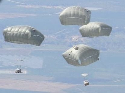 Jordanian Armed Forces members air drop aid parcels to several areas in northern Gaza, in this undated handout picture released on March 1, 2024.
