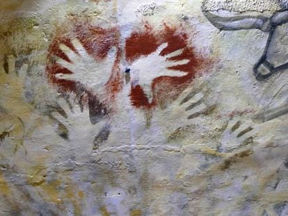 Painted hands in the cave of Altamira.