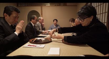 Various clients-partners of Mibu, in the middle of lunch. In the background, Tomiko Ishida.
