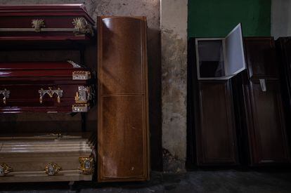 Wooden coffins at a funeral home in Petare (Caracas).