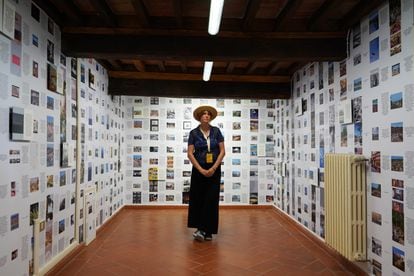 Photographer Marina Planas in a room of her installation. 