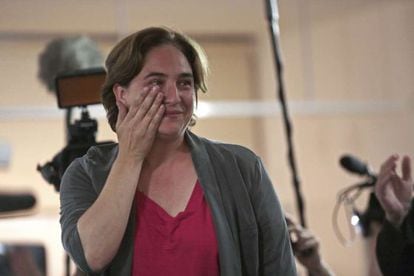 Ada Colau wipes a tear from her eye after winning the Barcelona mayoral race.