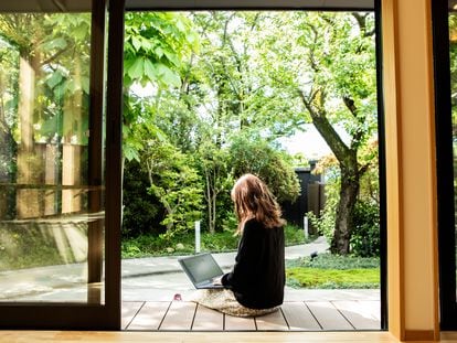 A digital nomad working remotely from a guesthouse in Japan
