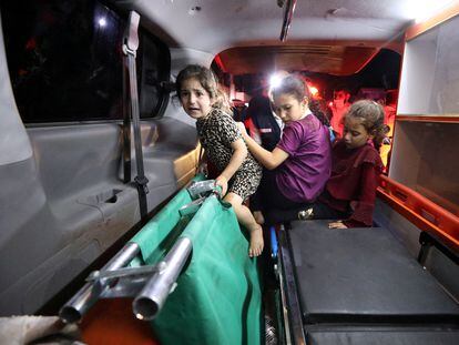 Three children in an ambulance after the attack on the al-Ahli al Arabi hospital in Gaza, on October 17.