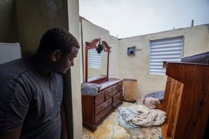 Nelson Cirino outside his bedroom after Hurricane Fiona tore the roof off his house in Loiza, Puerto Rico.