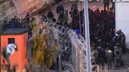 Moroccan police stop migrants from crossing into the Spanish exclave city of Ceuta in this file photo.