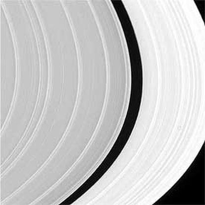 The Cassini-Huygens spacecraft in orbit around Saturn photographing the Sunlit rings.