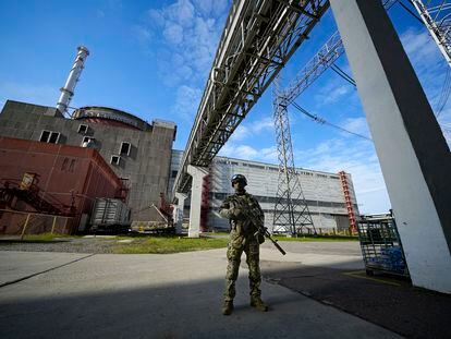A Russian serviceman guards in an area of the Zaporizhzhia Nuclear Power Station in territory under Russian military control, southeastern Ukraine, on May 1, 2022.
