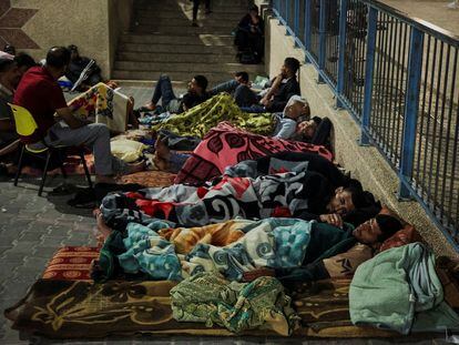 Palestinians who fled their houses amid Israeli strikes shelter at a United Nations-run school in Khan Younis in the southern Gaza Strip.