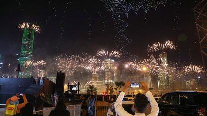 People watch fireworks and a light show, as Saudi Arabia celebrates winning its bid to host the World Expo 2030, in Riyadh, Saudi Arabia, November 28, 2023.