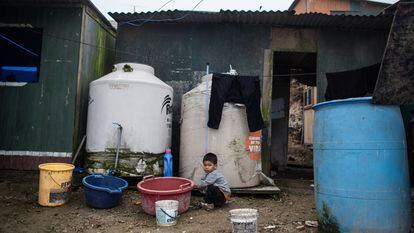 A child plays outside his home in the Nadine Heredia area in San Juan de Miraflores; Lima, Peru.