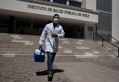 A worker leaving the Institute of Public Health in Santiago.