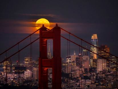A supermoon rises behind the Golden Gate Bridge and the San Francisco skyline as seen from Sausalito, Calif. on Thursday, Aug. 11, 2022.