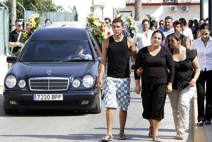 Mourners at the funeral of a Gypsy family, which was shot dead by José Antonio Zamora last week.