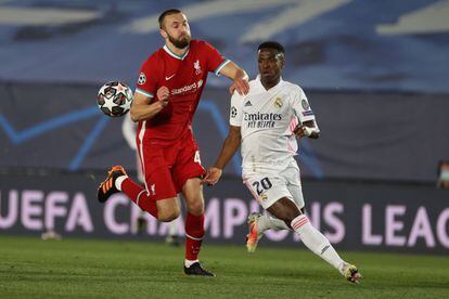 Real Madrid forward Vinicius Jr. and Liverpool defender Nathaniel Phillips.