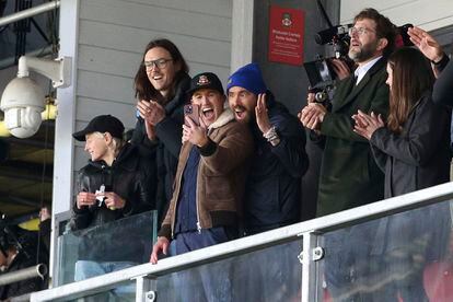 Wrexham owners Ryan Reynolds, center right, and Rob McElhenney, center left, react during the National League match between Wrexham and Notts County at the Racecourse Ground, Wrexham, Wales, Monday April 10, 2023