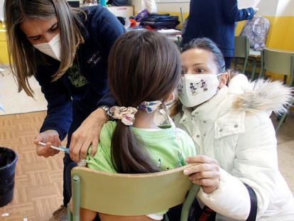 A health worker in Valencia vaccinates a child on Wednesday,