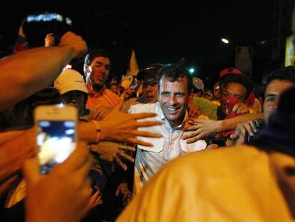 Venezuela presidential candidate Henrique Capriles greets supporters during a campaign rally in Caracas on April 1.