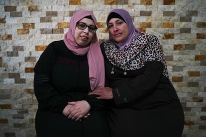 Azhar Assaf, a 25-year-old Palestinian prisoner released by Israel, with her mother Libia Othman in her home in the West Bank town of El Jeeb.