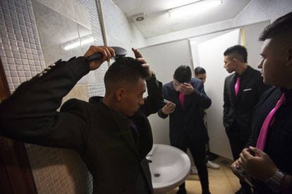 The young male guests getting ready in the bathroom.