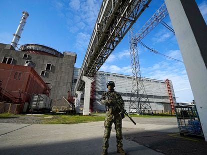 A Russian serviceman guards in an area of the Zaporizhzhia Nuclear Power Station in territory under Russian military control, southeastern Ukraine, Sunday, May 1, 2022.