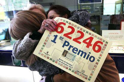 Three women celebrate their winning Christmas lottery ticket in Legan&eacute;s, Madrid on Sunday.